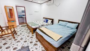 Postel nebo postele na pokoji v ubytování Thurai guest house 2