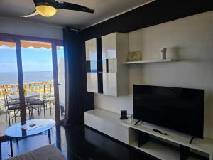 A television and/or entertainment centre at Sunset in Los Geranios by HelloApartments