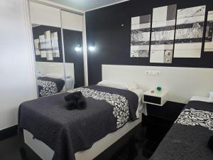 A bed or beds in a room at Sunset in Los Geranios by HelloApartments