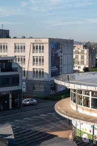 a view of a building with a parking lot at Studio apartman Barbara in Virovitica