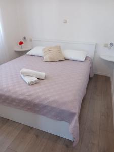Postel nebo postele na pokoji v ubytování Apartments Marina