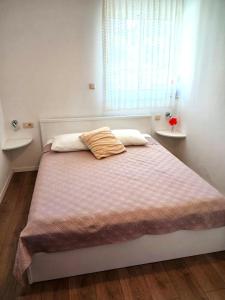 Postel nebo postele na pokoji v ubytování Apartments Marina