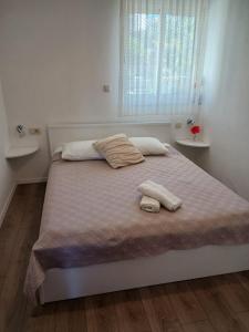 Postel nebo postele na pokoji v ubytování Apartments Marina