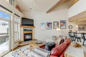 a living room with a couch and a fireplace at Cozy, Comfy and Convenient in Frisco