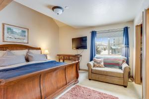 a bedroom with a bed and a chair and a window at Cozy, Comfy and Convenient in Frisco