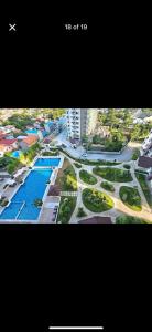 ein Poster einer Stadt mit einem Bild eines Resorts in der Unterkunft carpe diem staycation in Lapu Lapu City