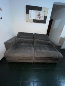 Posezení v ubytování Quarto aconchegante
