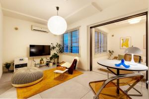 TV a/nebo společenská místnost v ubytování Cozy Stay Sapporo East