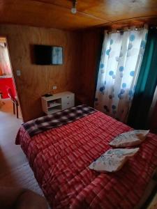Postel nebo postele na pokoji v ubytování Cabaña Lourdes
