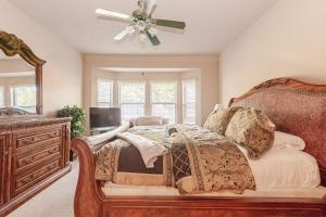 a bedroom with a bed and a ceiling fan at Nice big house in Woodlands area in Spring +33 photos