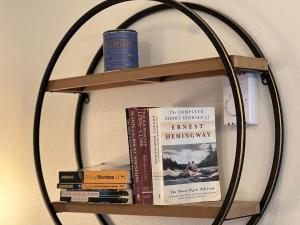 a book shelf with books on it at Bozeman Bungalow Downtown in Bozeman