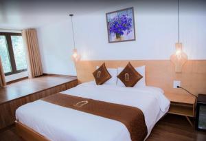 Postel nebo postele na pokoji v ubytování Beautiful Sapa Hotel