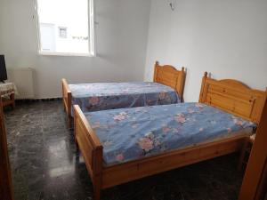 En eller flere senge i et værelse på Astypalaia Peyki