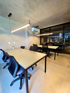 an office with tables and chairs in a room at Sofisticação e Luxo à Beira-mar no Cais Eco em Muro Alto by HM in Porto De Galinhas +287 photos