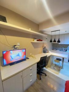 an office with a desk with a computer on it at Student Park, Kamar baba in Sleman