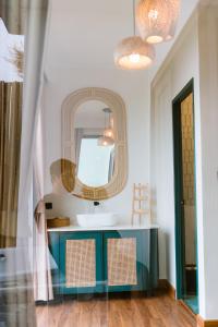 a bathroom with a blue vanity and a mirror at เลอค่าดอยช้าง Le Quar Doi Chang Cafe Bistro Bed & Breakfast in Ban San Pu Loei +68 photos