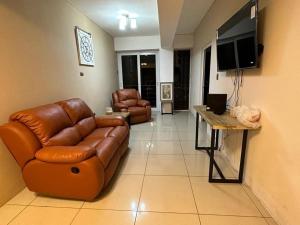 Televisyen dan/atau pusat hiburan di Apartamentos Small Ville