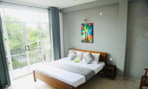 Postel nebo postele na pokoji v ubytování kandy hill villa
