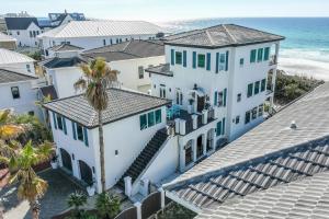 an aerial view of a white house and the ocean at Emerald View on 30A in Santa Rosa Beach