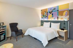 Ein Bett oder Betten in einem Zimmer der Unterkunft Spark by Hilton Vienna Donaustadt