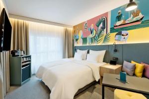 Ein Bett oder Betten in einem Zimmer der Unterkunft Spark by Hilton Vienna Donaustadt