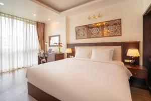 Voodi või voodid majutusasutuse Hotel Du Palace toas