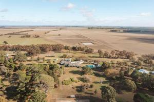 an aerial view of a farm with a field at Tiny Helen in Carngham