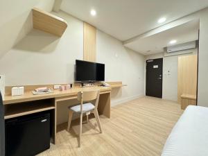 TV a/nebo společenská místnost v ubytování Yoshi Hotel - Tainan Sinmei Branch
