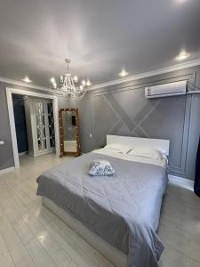 Katil atau katil-katil dalam bilik di Apartamenty Yermekova LoftApart