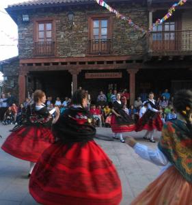 a group of people dancing in front of a crowd at Madre Terra in La Puebla de la Sierra