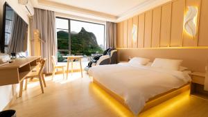 Postel nebo postele na pokoji v ubytování Yibuxuan Boutique Hotel Yangshuo