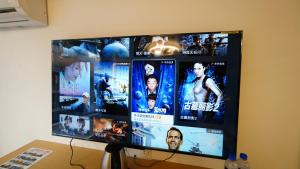 TV a/nebo společenská místnost v ubytování Yibuxuan Boutique Hotel Yangshuo