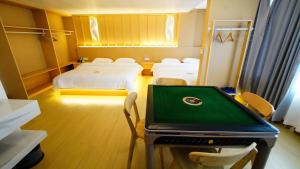 Postel nebo postele na pokoji v ubytování Yibuxuan Boutique Hotel Yangshuo