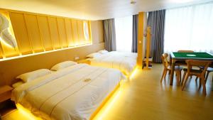 Postel nebo postele na pokoji v ubytování Yibuxuan Boutique Hotel Yangshuo