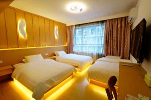 Postel nebo postele na pokoji v ubytování Yibuxuan Boutique Hotel Yangshuo + 37 fotografií