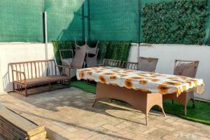 a table and two chairs sitting on a patio at Charming House in Chiclana de la Frontera with Terrace in Chiclana de la Frontera