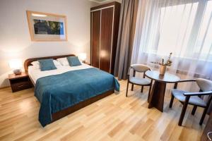 Ένα ή περισσότερα κρεβάτια σε δωμάτιο στο Ośrodek Szkoleniowo Wypoczynkowy Galicya