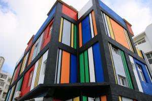 a multicolored building with many colors on it at The Beauty of Basalt B&B in Magong