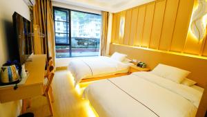 Postel nebo postele na pokoji v ubytování Yibuxuan Boutique Hotel Yangshuo