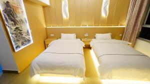 Postel nebo postele na pokoji v ubytování Yibuxuan Boutique Hotel Yangshuo