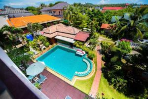 an aerial view of a house with a swimming pool at Monaburi Boutique Resort in Rawai Beach