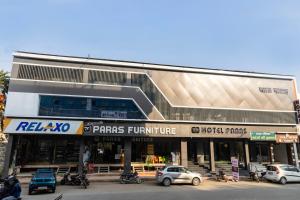 a building with cars parked in front of it at Hotel Paras Chittorgarh in Chittaurgarh