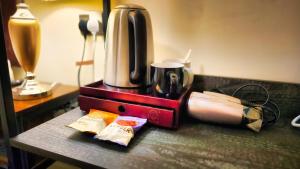 a coffee maker sitting on top of a table at Carlton Hotel in Weymouth