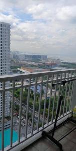 a view of a city from the balcony of a building at Staycation at a Breeze 01 in Manila