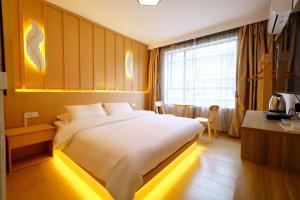 Postel nebo postele na pokoji v ubytování Yibuxuan Boutique Hotel Yangshuo