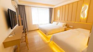 Postel nebo postele na pokoji v ubytování Yibuxuan Boutique Hotel Yangshuo