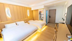 Postel nebo postele na pokoji v ubytování Yibuxuan Boutique Hotel Yangshuo