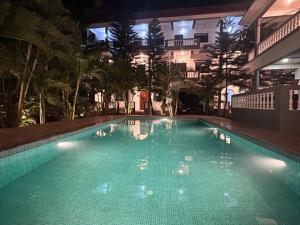 a swimming pool in a building at night at The Blackbuck Ashwem in Mandrem