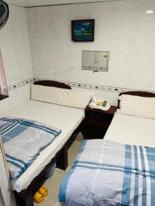 Ένα ή περισσότερα κρεβάτια σε δωμάτιο στο GLOBAL INN RECEPTION FLAT c 4 13 TH FLOOR BLOCK C