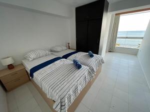 Ένα ή περισσότερα κρεβάτια σε δωμάτιο στο Modern Seaside Retreat, 3BR, Unbeatable Views +20 φωτογραφίες